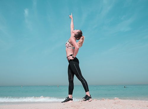 woman-pointing-at-sky-on-seashore-1117493 woman-pointing-at-sky-on-seashore-1117493