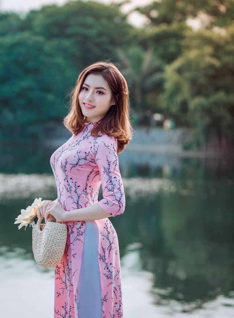 woman-standing-and-doing-pose-beside-lake-1468379